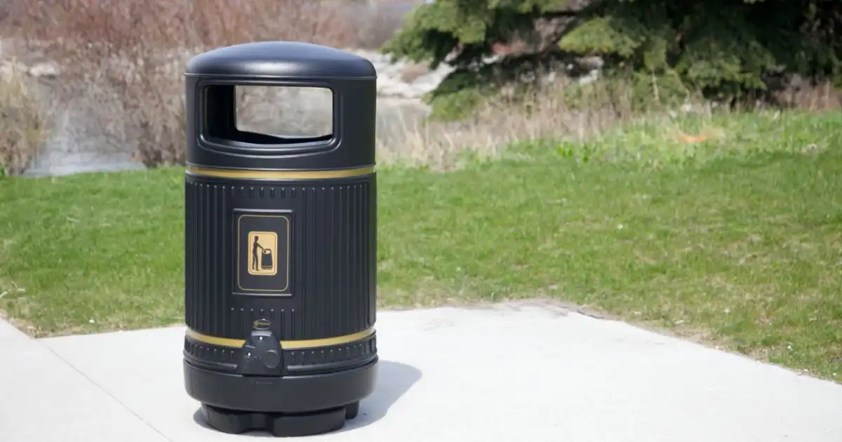 Public trash bin with “No Litter” sign